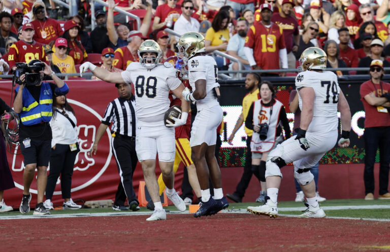 No. 5 Notre Dame clinches College Football Playoff spot with 2 pick 6s in 49–28 win over USC